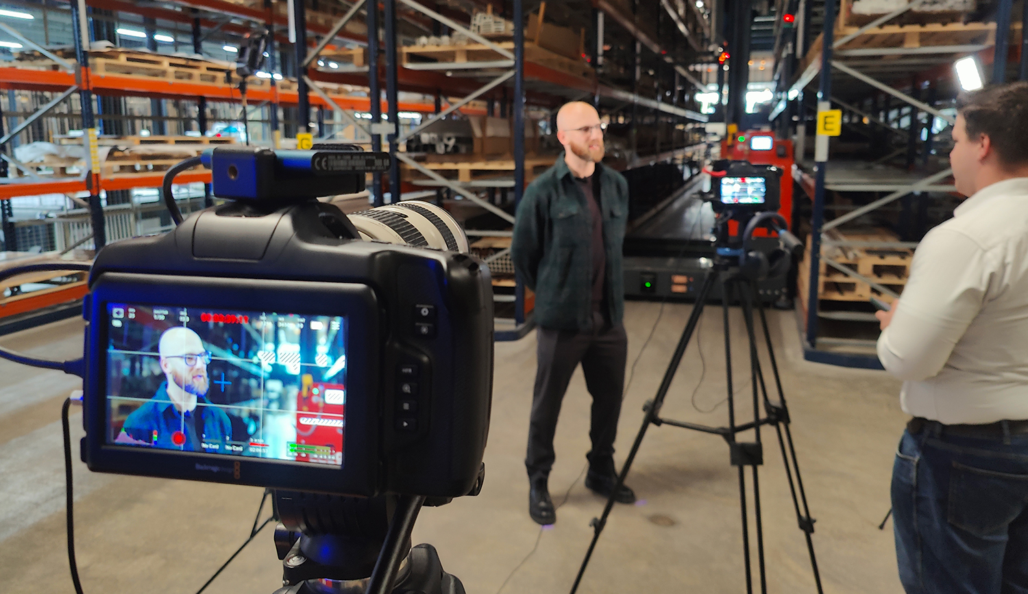 professional videographer filming corporate event